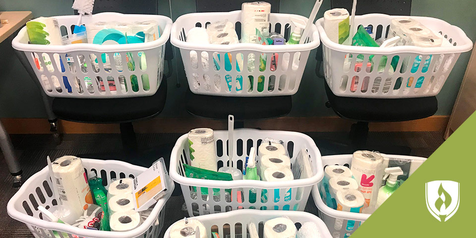 laundry baskets full of household cleaning products