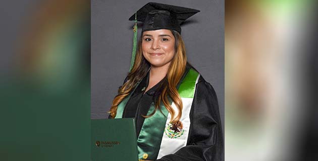 Graduate holding diploma