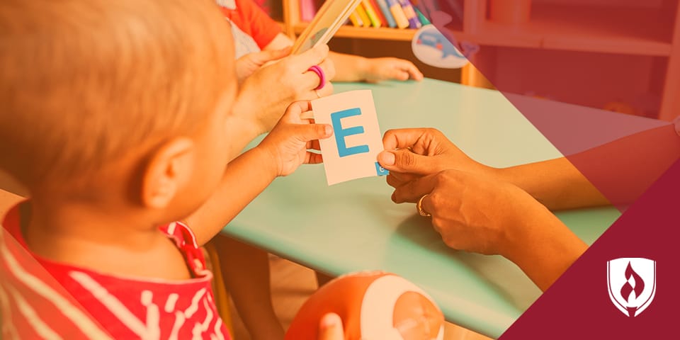 teaching child alphabet with orange overlay