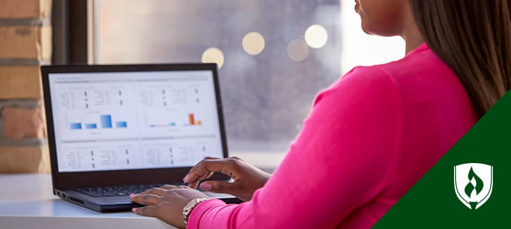 Professionally dressed woman making a business presentation to colleagues