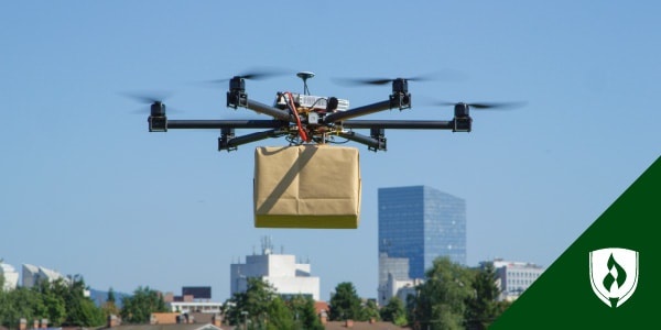 photo of a drone carrying a package representing drone logistics