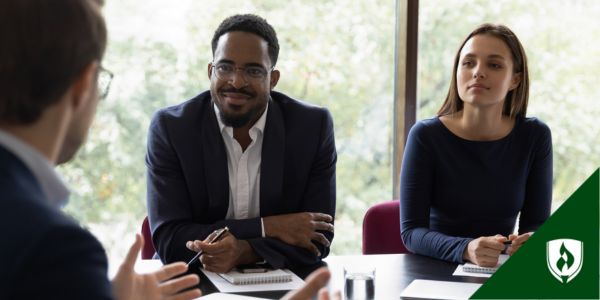 Two accountants meet with a client