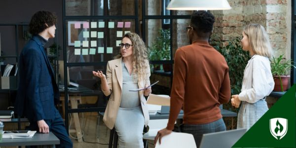 A manager talks with her team in an open circle