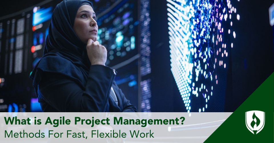 A project manager looks over multiple screens of information