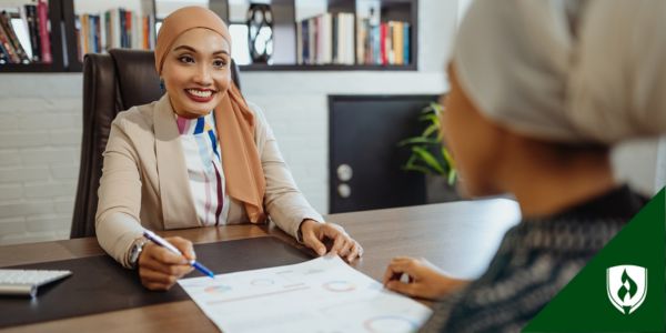 A financial advisor sits with her client