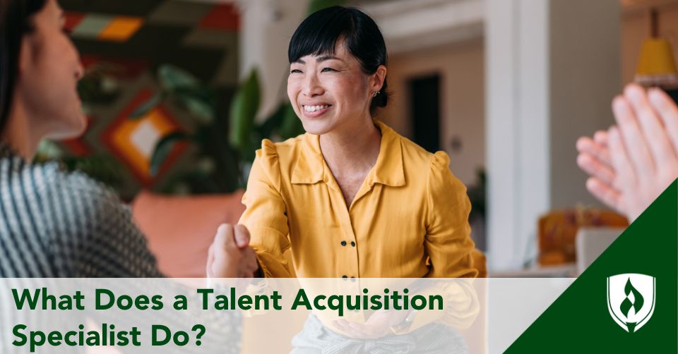 A talent acquisition specialist shakes hands with a job applicant