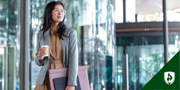 A lawyer walks into a big glass building for her first day