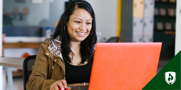 An ECE teacher works at a computer