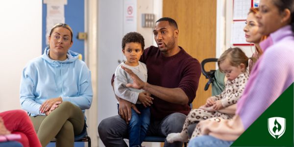 A group of parents talk with an ECE educator