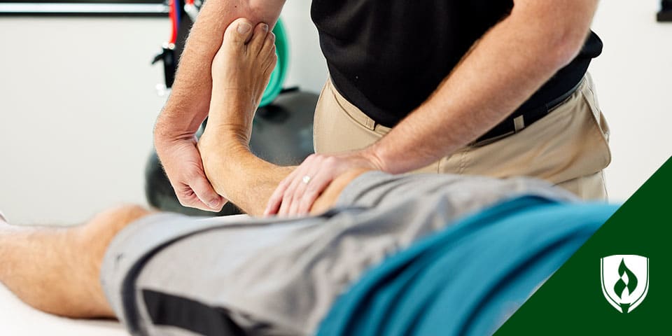 photo of a pta lifting a patient's leg representing how to become a physical therapist assistant (and why you should)