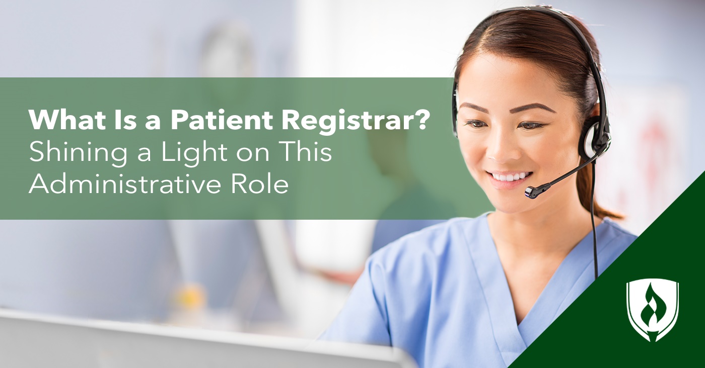 photo of a patient registrar working at a desk with a headset on