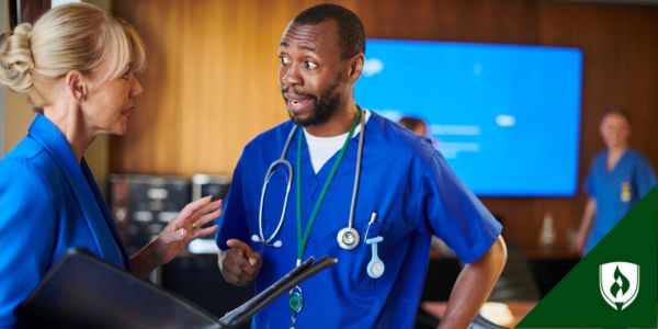 A nurse and a healthcare administrator conversate intensely