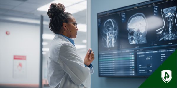 A radiologist looks at images of a brain