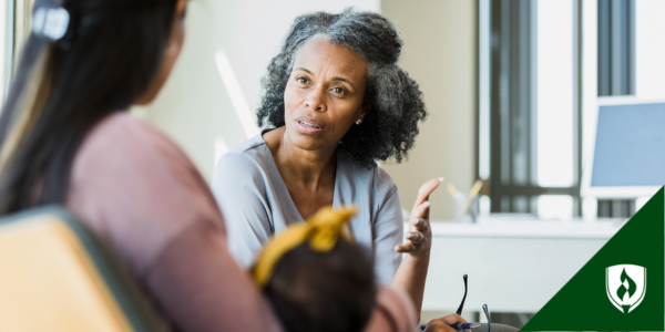 A human services coordinator meets with a mother and her child