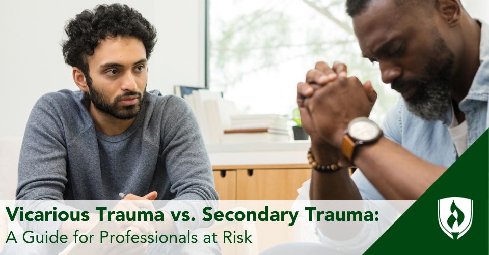 A social services assistant sits with a man talking about his trauma