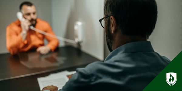 A criminal psychologist speaks with an incarcerated person