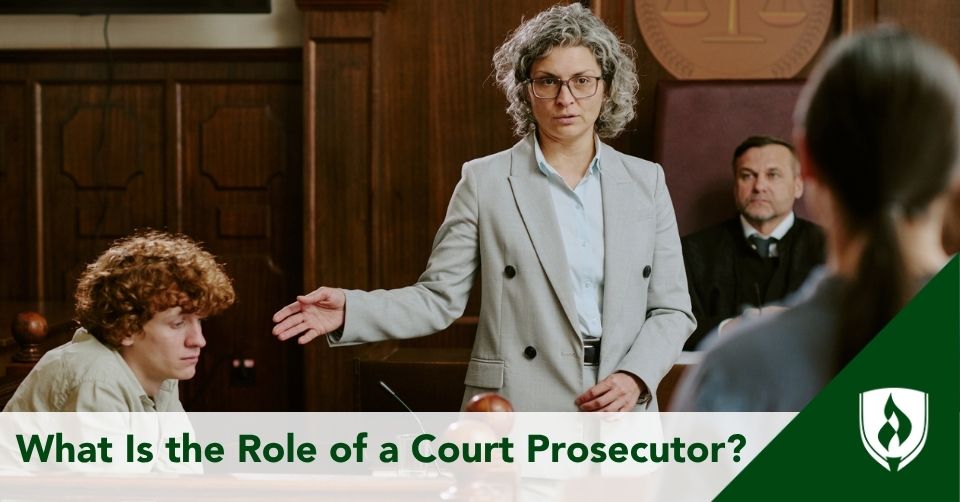 A court prosecutor gestures at a defendant