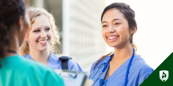 A CNA instructor talks with a nurse and a CNA