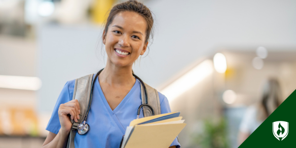 A nursing student with a backpack and scrubs heads into clinicals