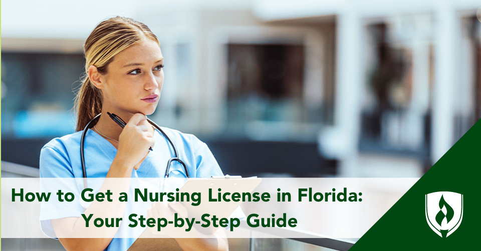 A white, female nurse looks out over a sunny atrium with a clipboard in hand