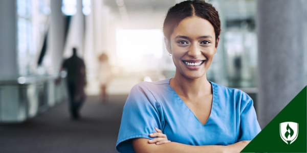 A nurse with an ADN smiles in front of her clinic