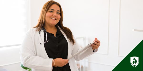 A nurse practitioner smiles at the camera