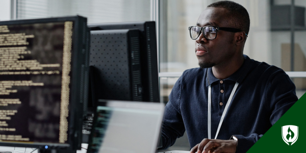 A cyber security student works on the computer