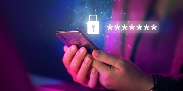 cyber security specialist holding mobile phone