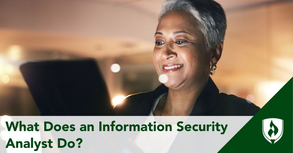 An information security analyst looking at a tablet in her office