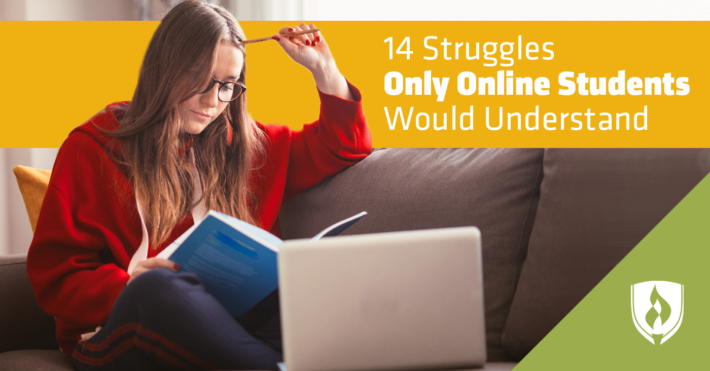 Female student studying on a couch with a book and laptop