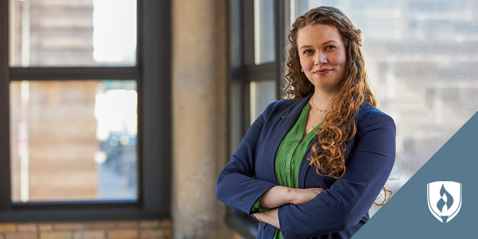 female professional standing with arms crossed