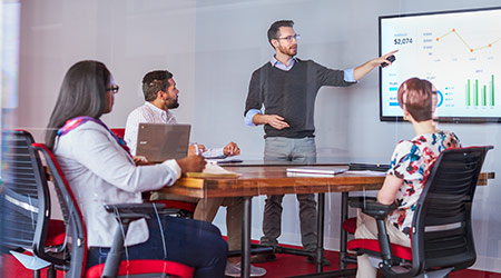 man presenting charts-graphs in meeting