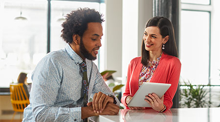 business woman holding tablet meeting with business man