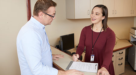 female healthcare professional helping a patient