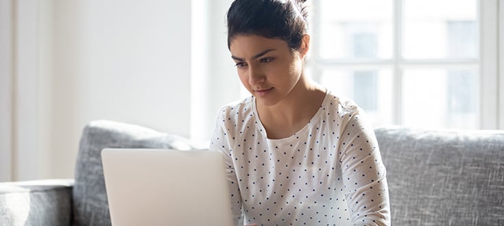 Female criminal justice student on laptop