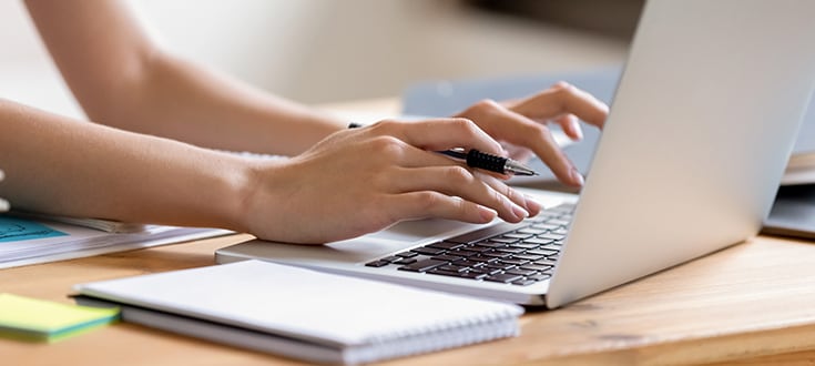 Female hands on labtop