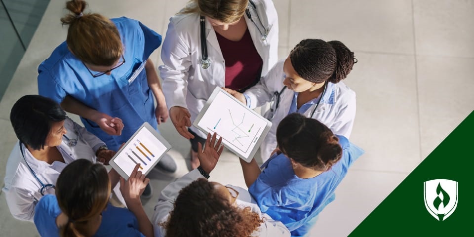 illustration of a huddle of nurses looking at charts representing clinical informatics nurse